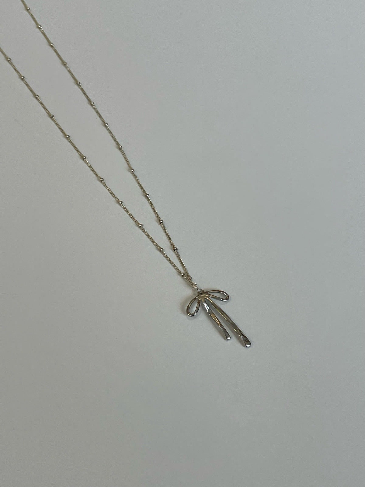 Louise Bow Necklace - Gold or Silver Necklaces