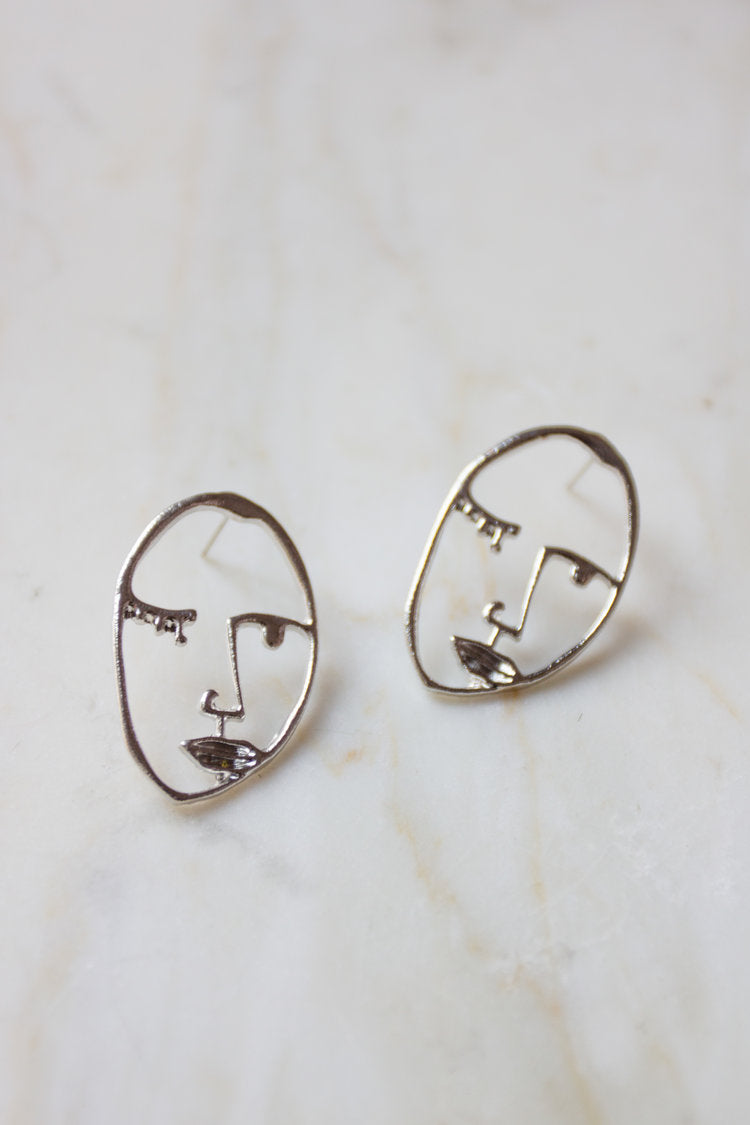 Abstract face earrings top h&m